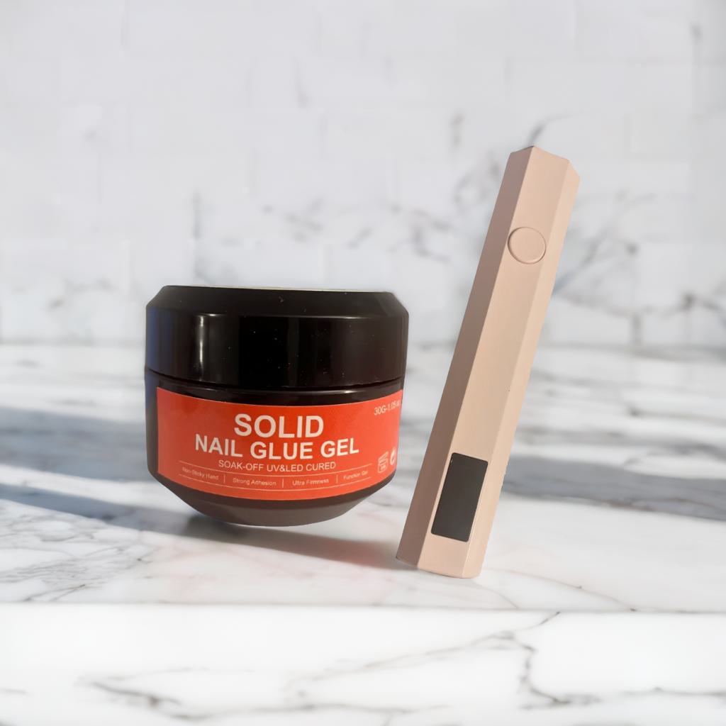 Solid nail glue and UV lamp pen kit