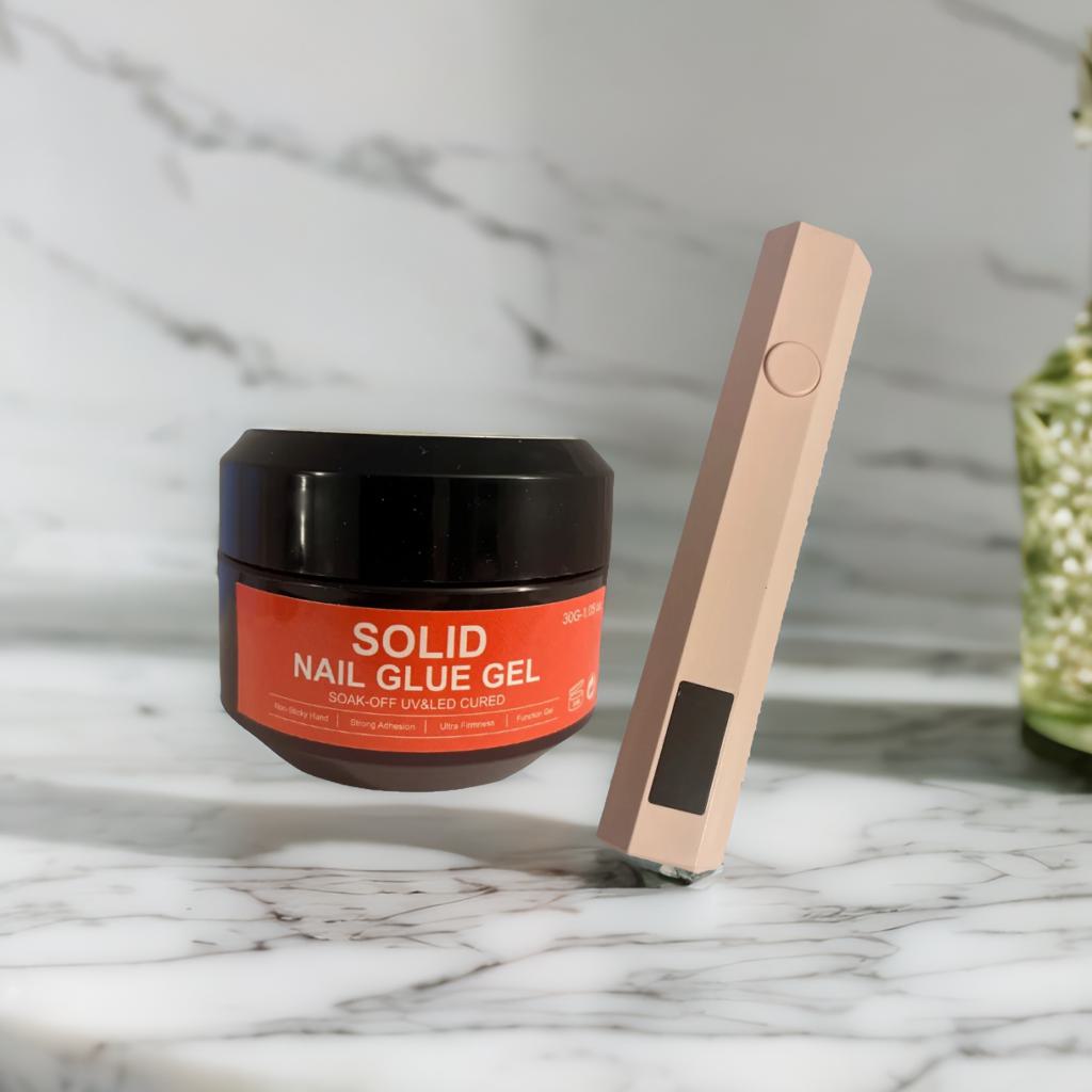 Solid nail glue and UV lamp pen kit