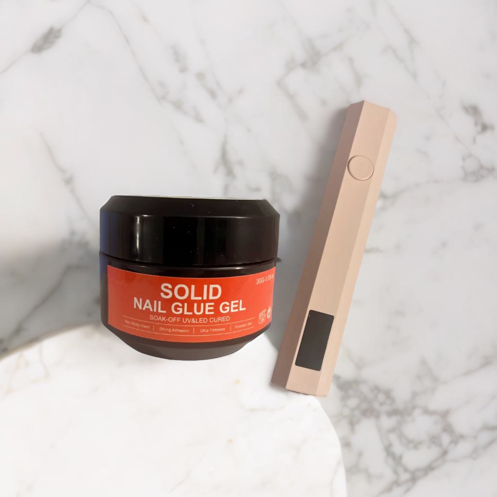 Solid nail glue and UV lamp pen kit